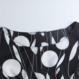 1950s White and Black Sleeveless Retro Polka Dot Belted Vintage Dress